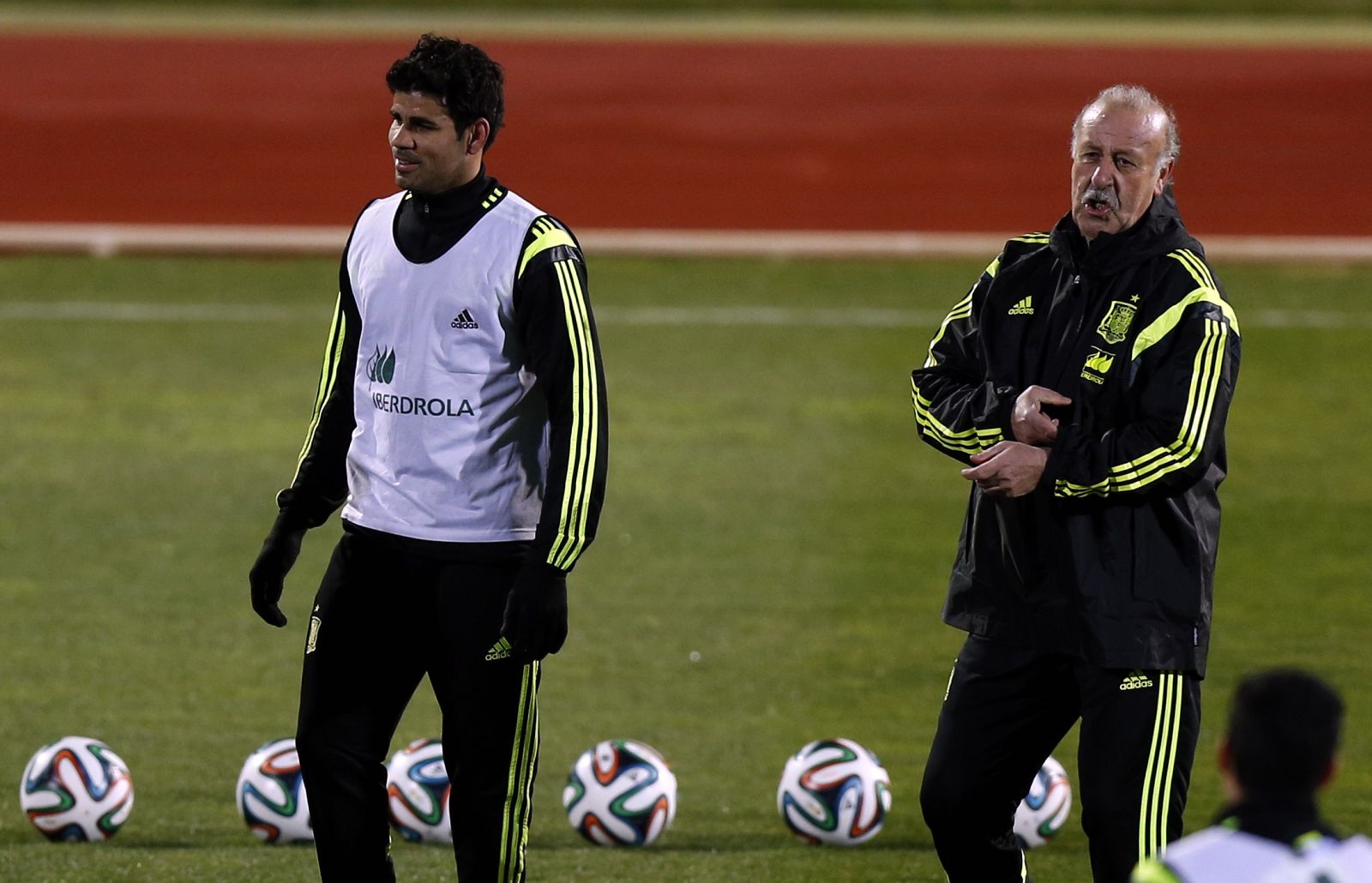 Spain's Diego Costa stands beside coach Vicente del Bosque during a training session at Soccer City grounds in Las Rozas