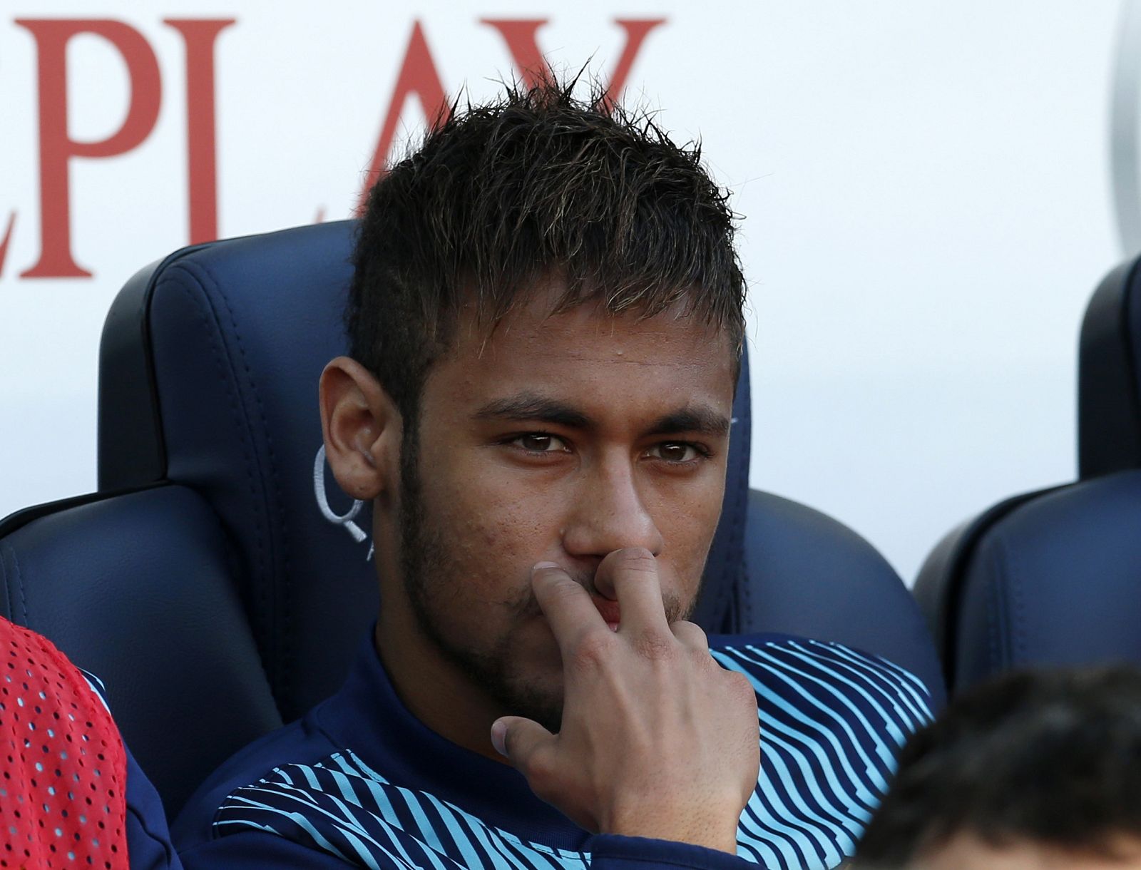 Barcelona's Neymar sits on the bench before their Spanish first division soccer match against Osasuna at Camp Nou stadium in Barcelona