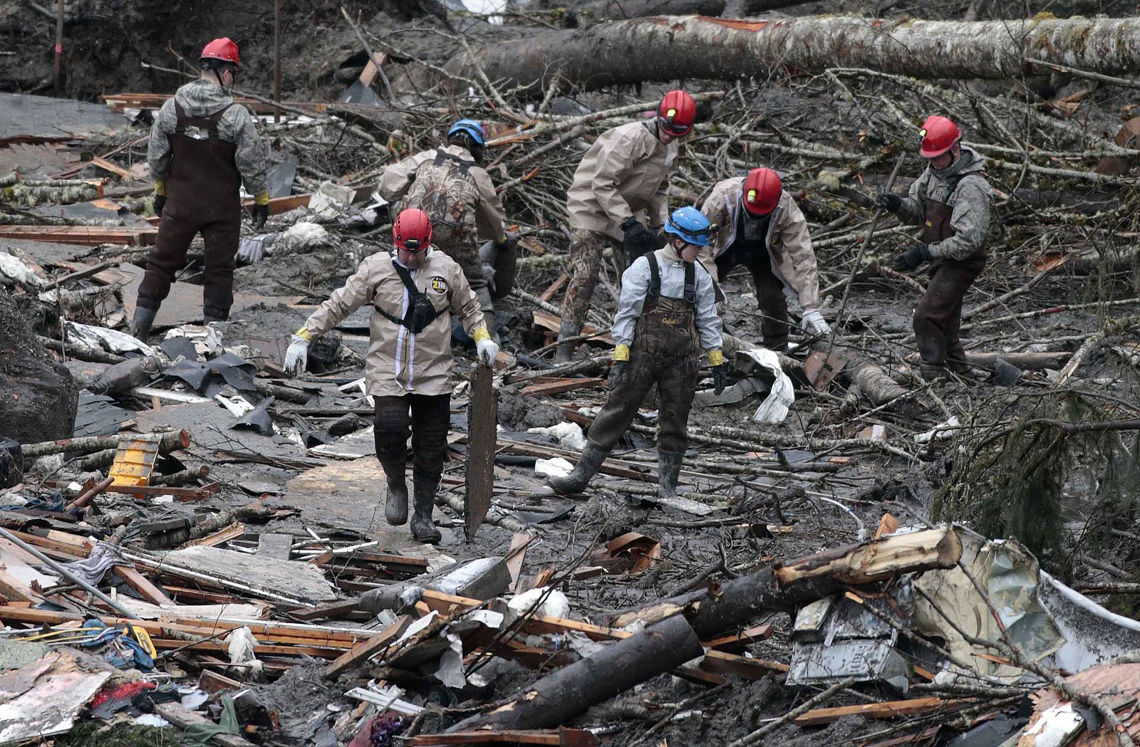 Workers search for victims in a massive mudslide in Oso
