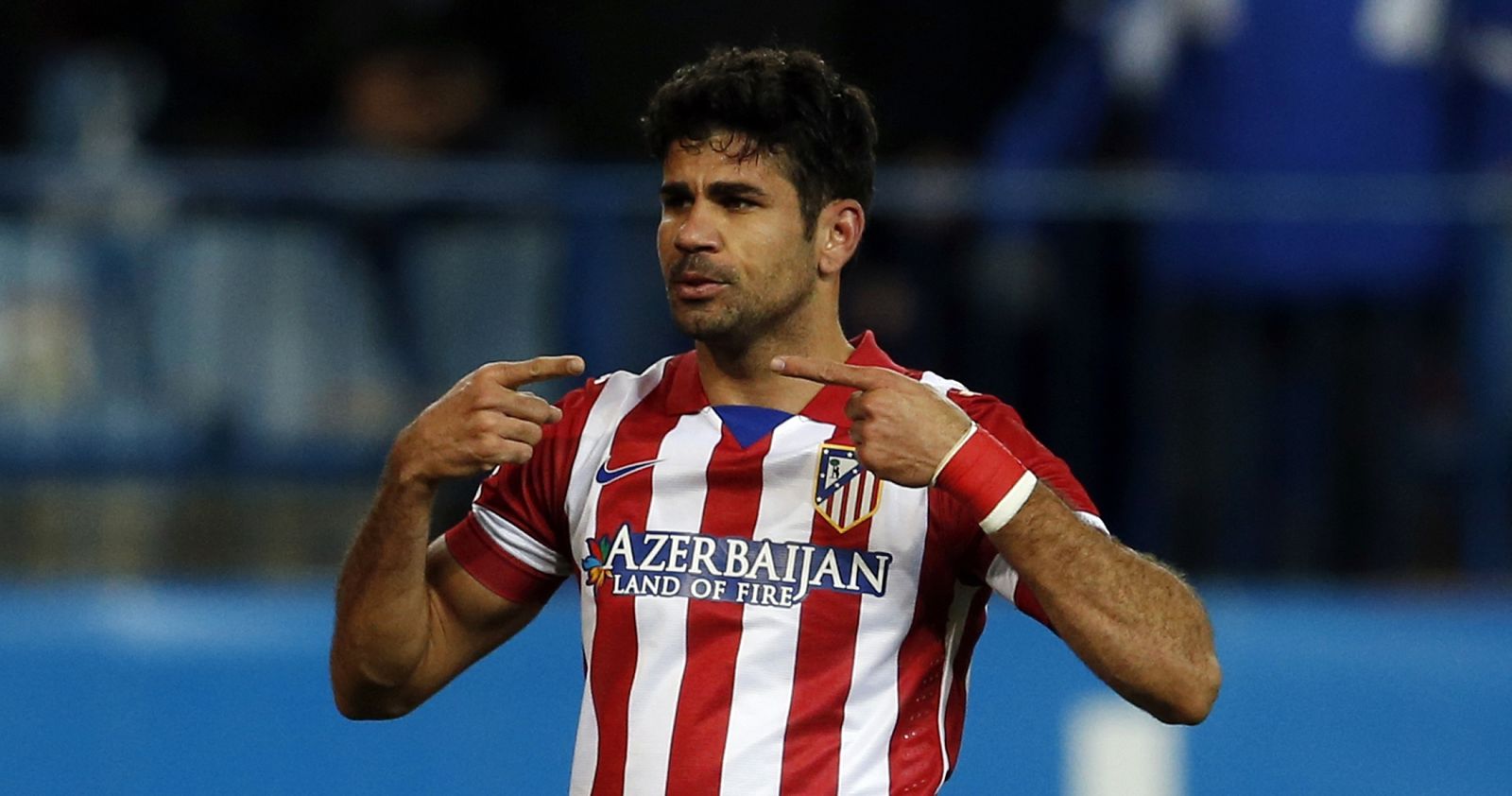 Atletico Madrid's Costa celebrates scoring a goal against Granada during their Spanish First Division soccer match in Madrid