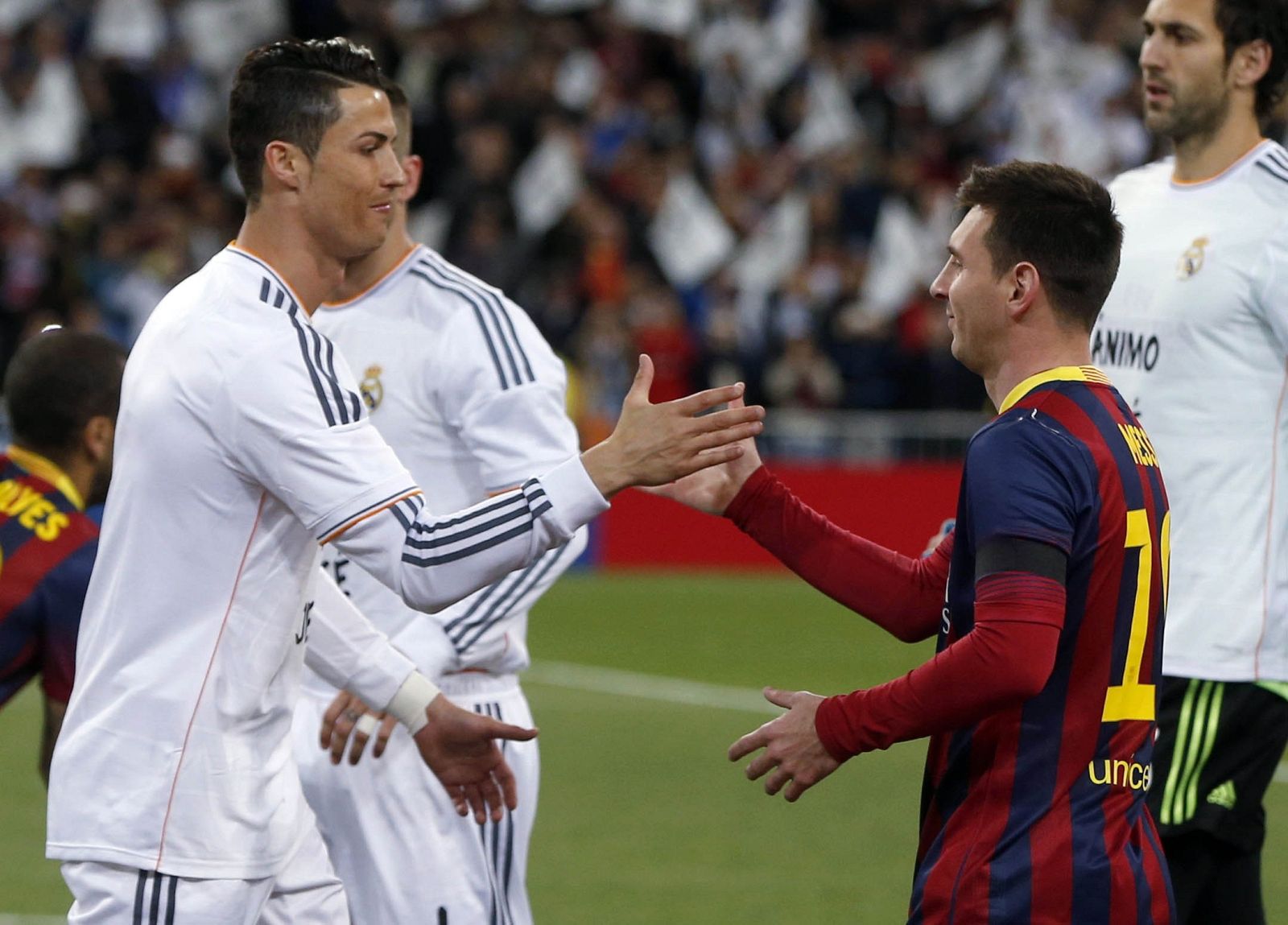 Real Madrid's Cristiano Ronaldo shakes hands with Barcelona's Lionel Messi before La Liga's second 'Clasico' soccer match of the season in Madrid