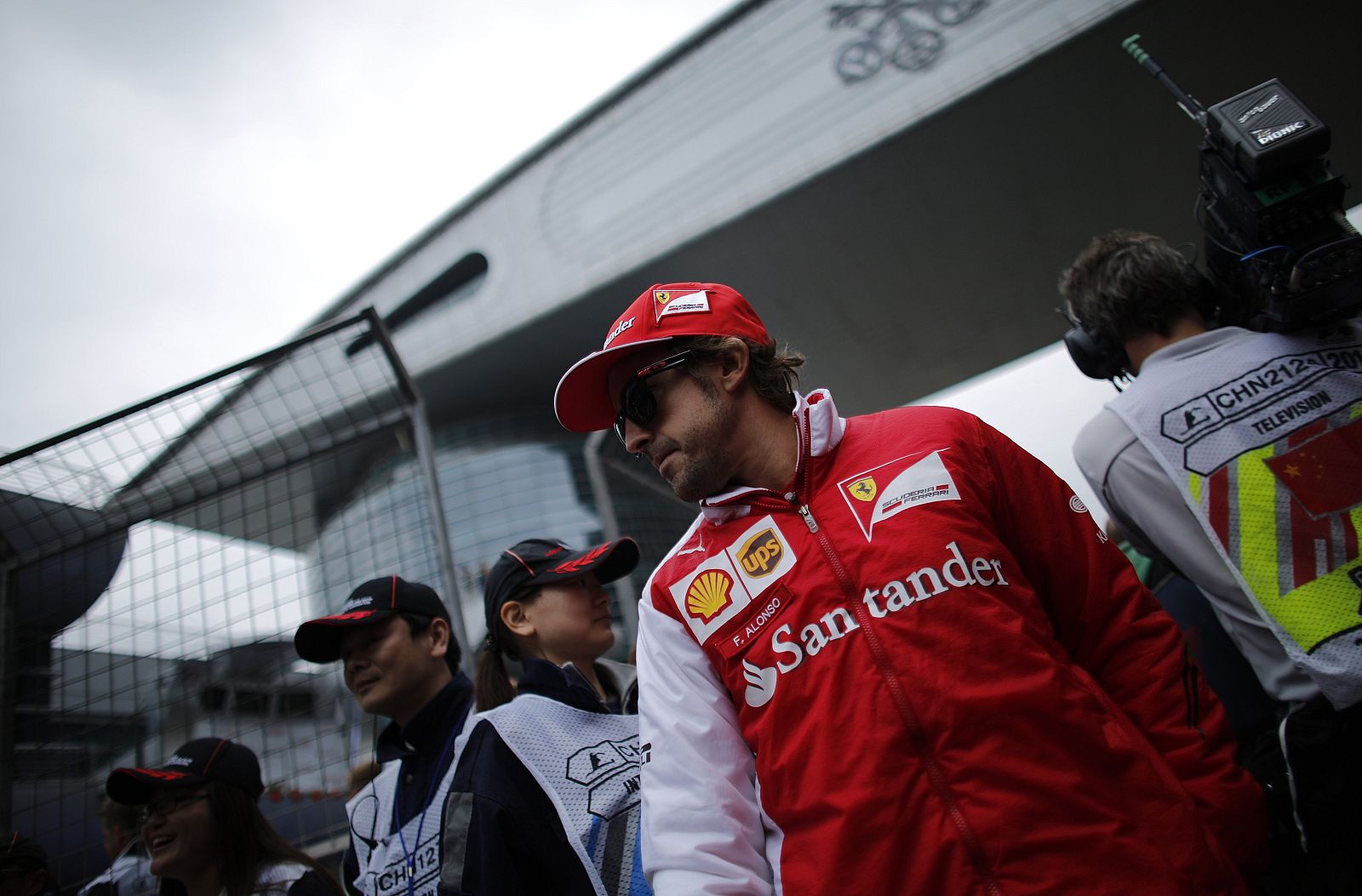 Ferrari Formula One driver Fernando Alonso of Spain walks during the Chinese F1 Grand Prix at the Shanghai International Circuit