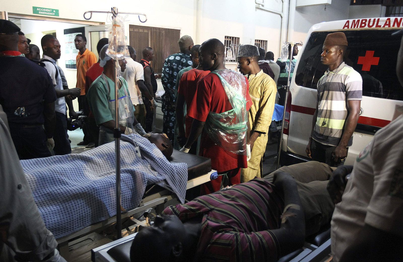 People who were injured during an explosion are seen on stretchers at Asokoro General Hospital in Abuja