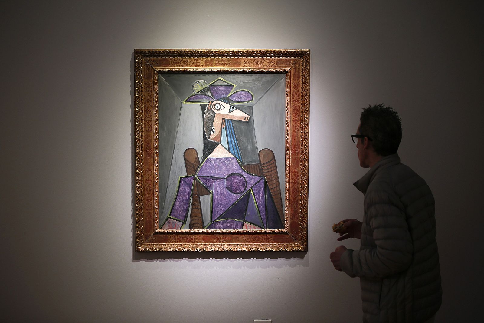 A man looks at Pablo Picasso's "Portrait de femme (Dora Maar)" during a preview of the Impressionist and Modern Art sale at Christie's in New York