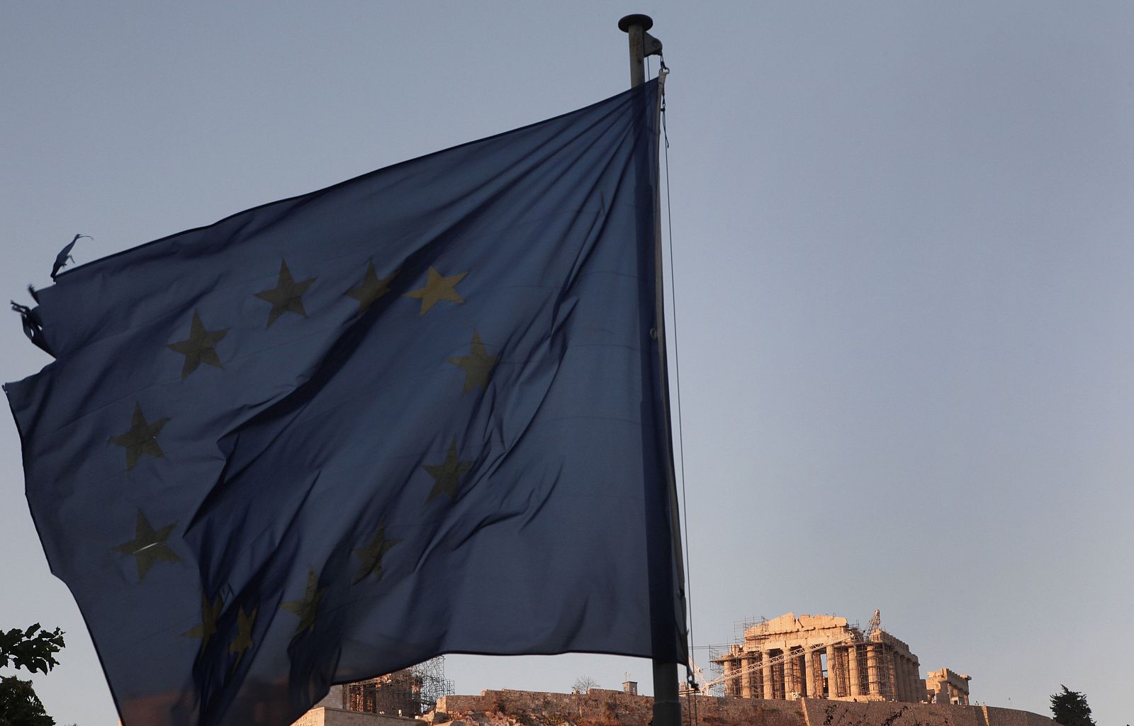 An European Union flag flutters in front of the Parthenon temple in Athens