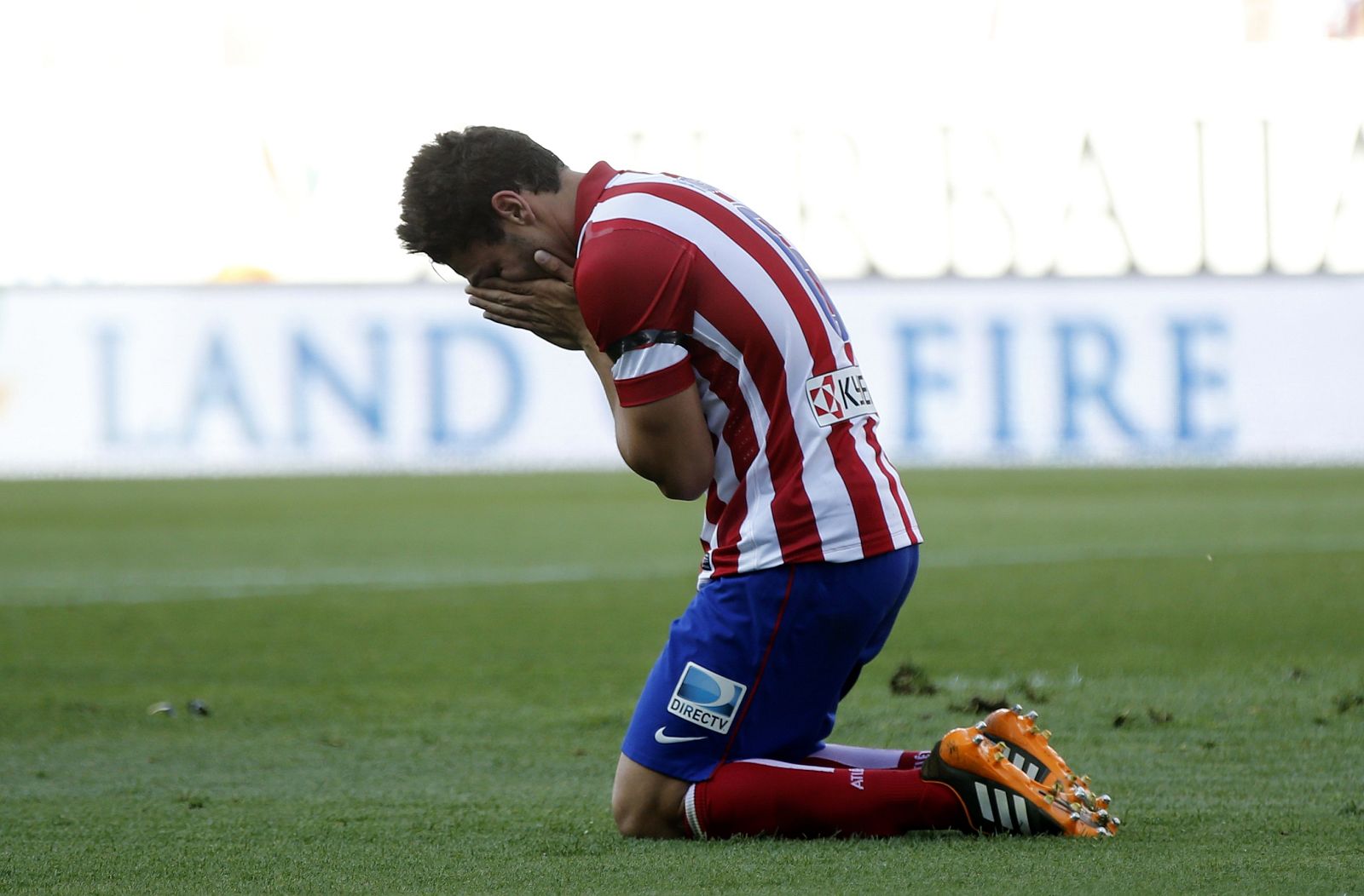 Atletico Madrid's Koke reacts after missing a chance to score against Malaga during their Spanish first division soccer match in Madrid