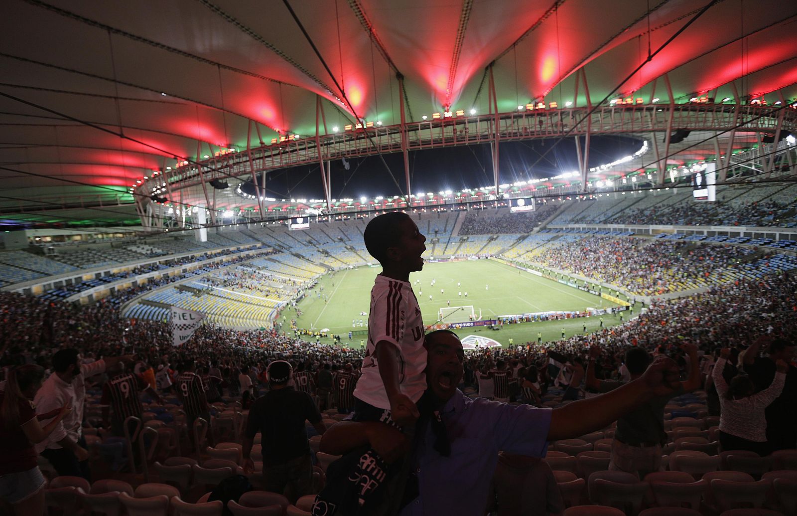 Fluminense fans celebrate a goal during a Brazilian championship soccer match against Sao Paulo in Maracana stadium in Rio de Janeiro