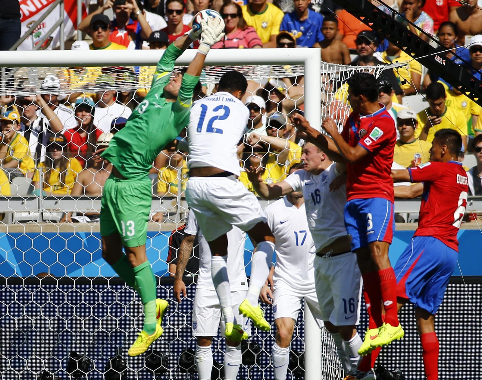 England's goalkeeper Ben Foster (in gree) catches the ball during their 2014 World Cup Group D soccer match against Costa Rica at the Mineirao stadium in Belo Horizonte