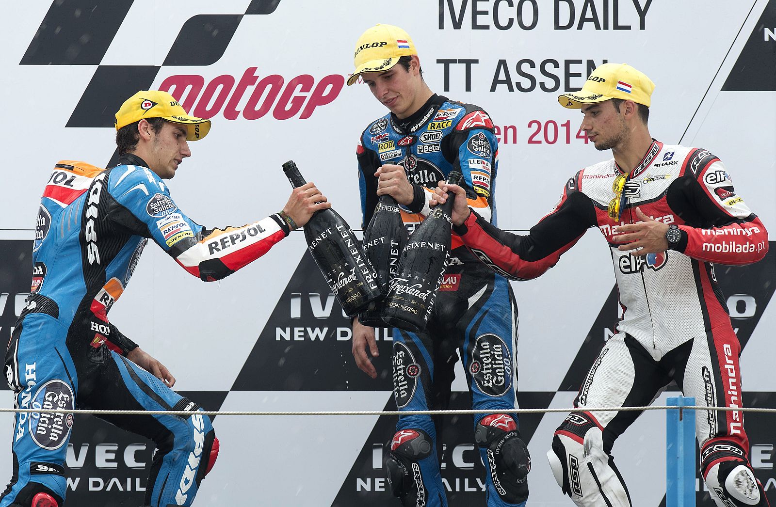 Honda Moto3 riders Rins and Marquez of Spain and Mahindra rider Oliveira of Portugal celebrate on the podium after winning the Dutch Grand Prix