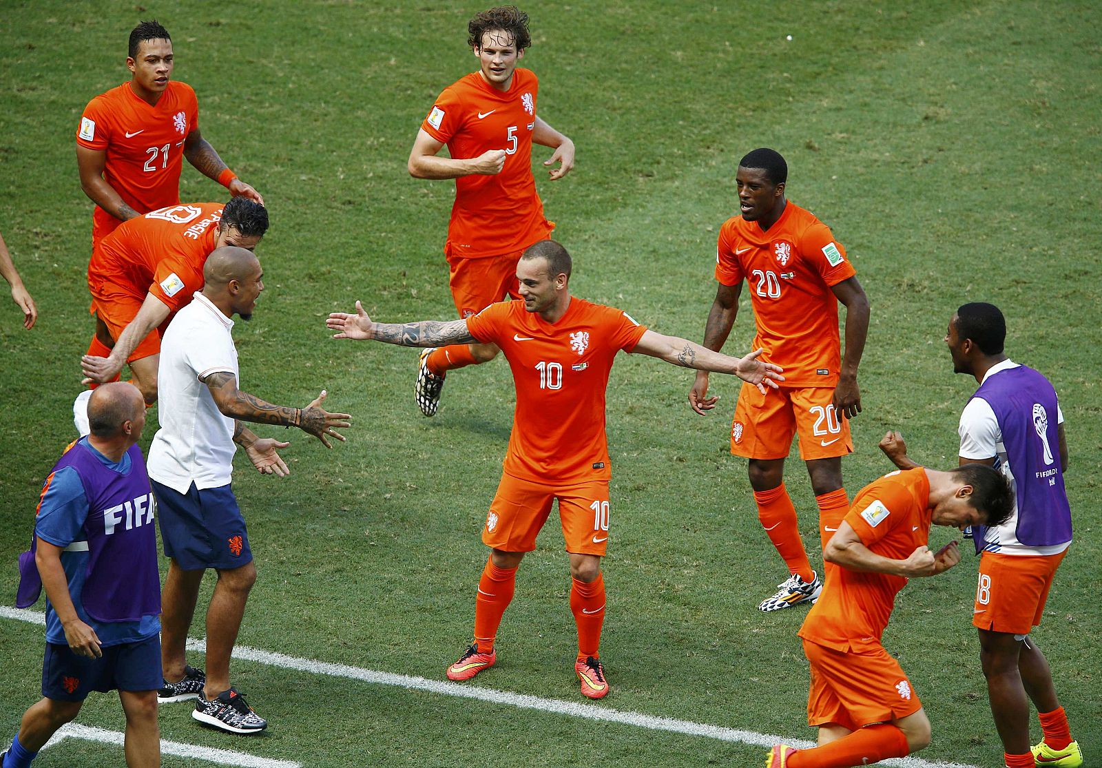 Sneijder of the Netherlands celebrates with his teammates after scoring against Mexico during their 2014 World Cup round of 16 game at the Castelao arena in Fortaleza