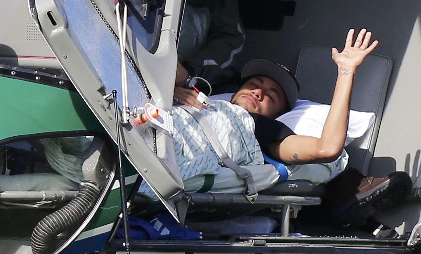 Injured Brazilian national soccer team player Neymar waits to be airlifted home from Brazil's training camp inTeresopolis