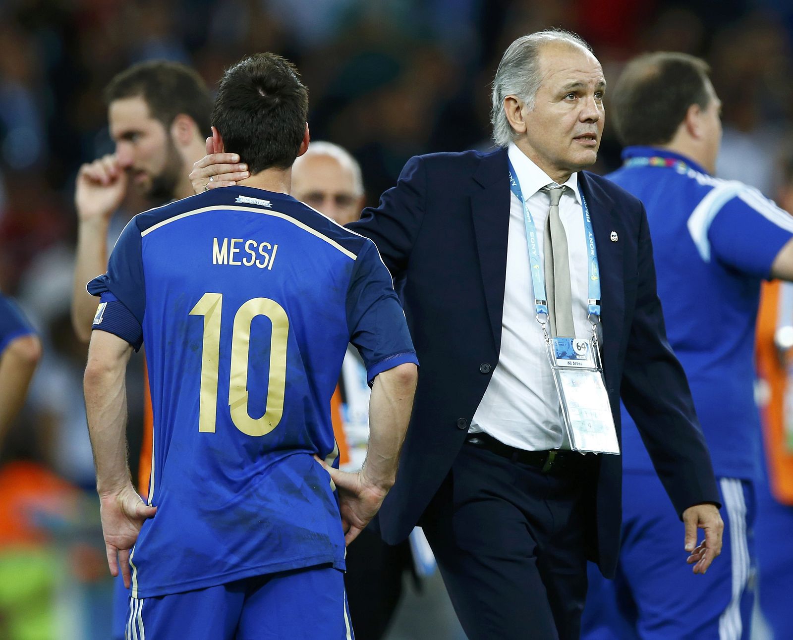 Argentina's coach Alejandro Sabella consoles Lionel Messi, who was awarded the Golden Ball for best player of the tournament, after losing their 2014 World Cup final against Germany at the Maracana stadium in Rio de Janeiro