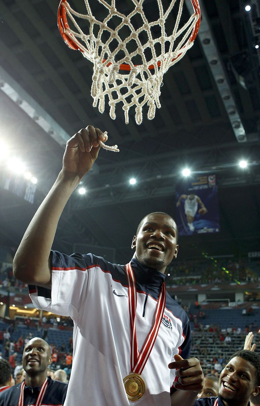 Durant of U.S. shows a piece of the basket's net after defeating Turkey in the FIBA Basketball World Championship final game in Istanbul