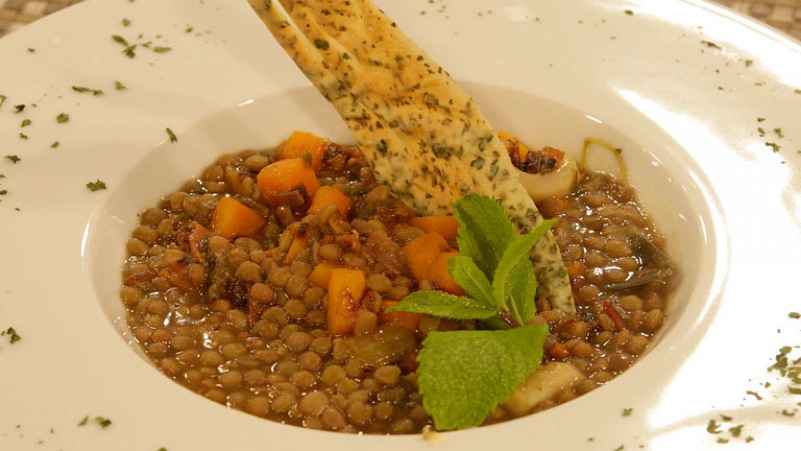 Lentejas con calabaza y calamares al ajillo