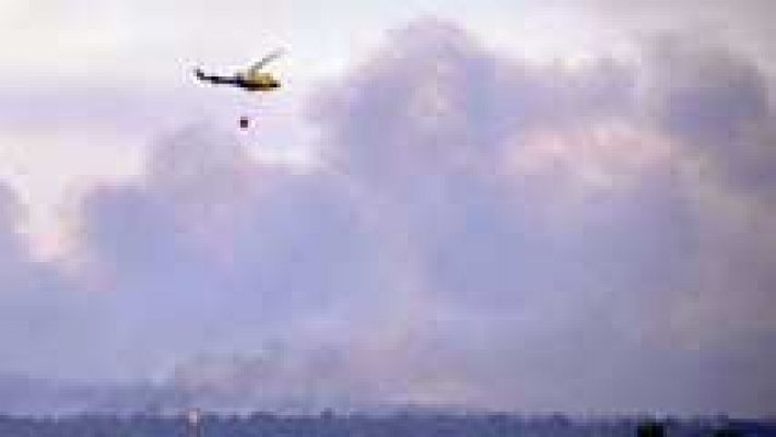 Telediario 1 - Trabajos de extinción de incendios