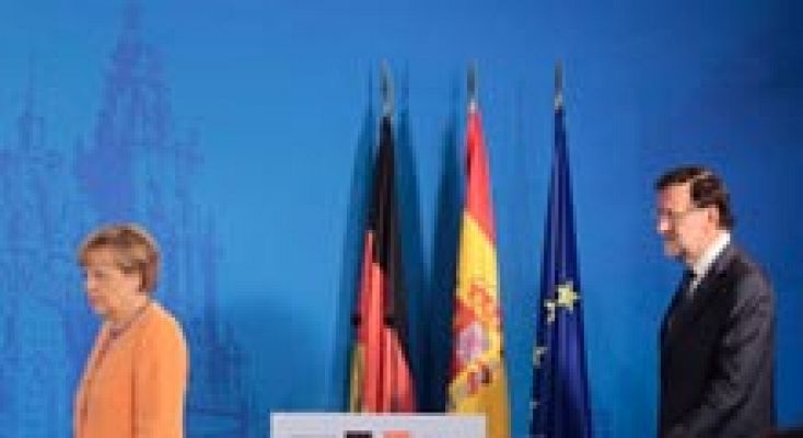 Merkel apoya en Santiago la candidatura de Luis de Guindos para dirigir el Eurogrupo