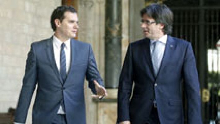 Rivera insta sin éxito a Puigdemont a no quedar al margen de las reformas de España