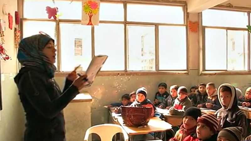 Los niños vuelven a la escuela en Alepo