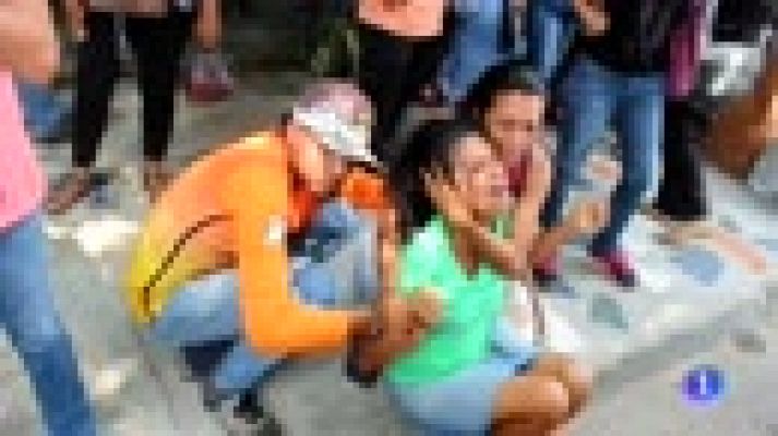 Telediario 1 - Al menos 68 personas mueren en un incendio durante un motín en un centro de detención venezolano