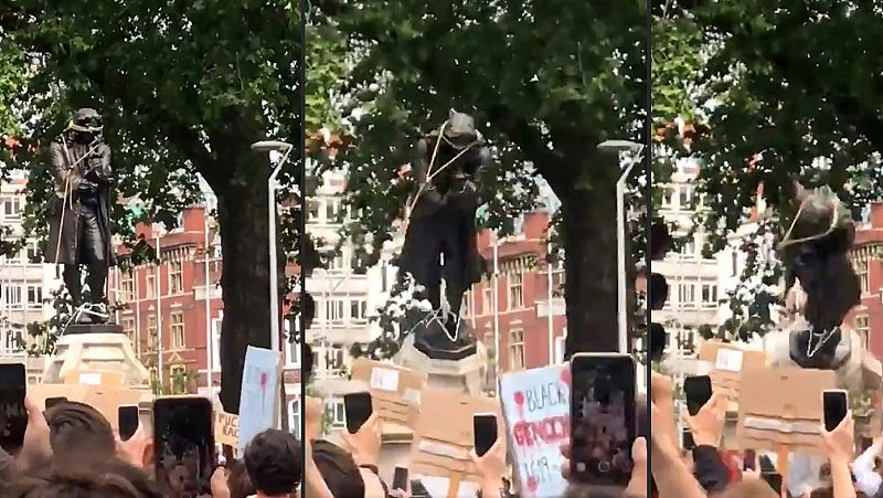 Varios manifestantes derriban en Bristol la estatua de un tratante de esclavos como protesta por la muerte de George Floyd
