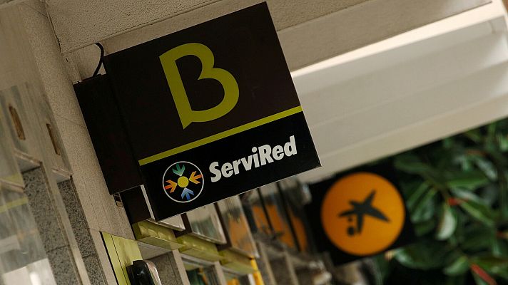 Telediario 1 - Bankia deja de cotizar en bolsa y se da de baja como sociedad mercantil como pasos previos a su integración en CaixaBank